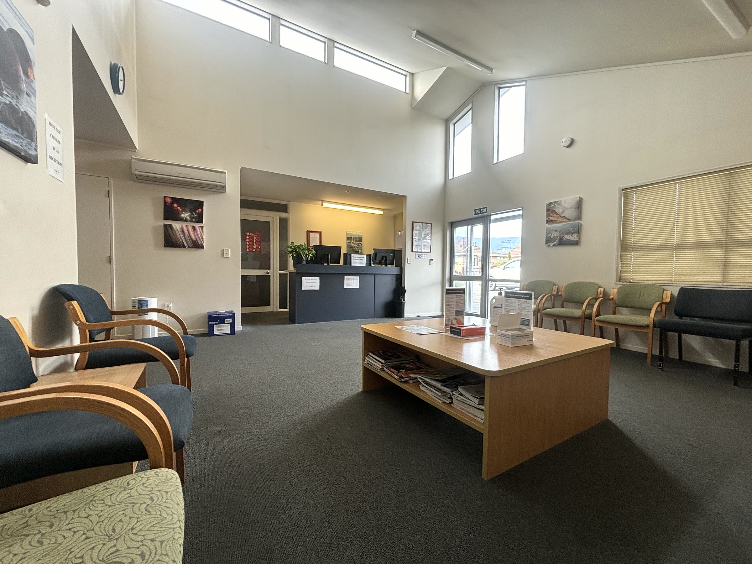 The waiting room, with its raked ceiling and clerestory windows, looking through to reception